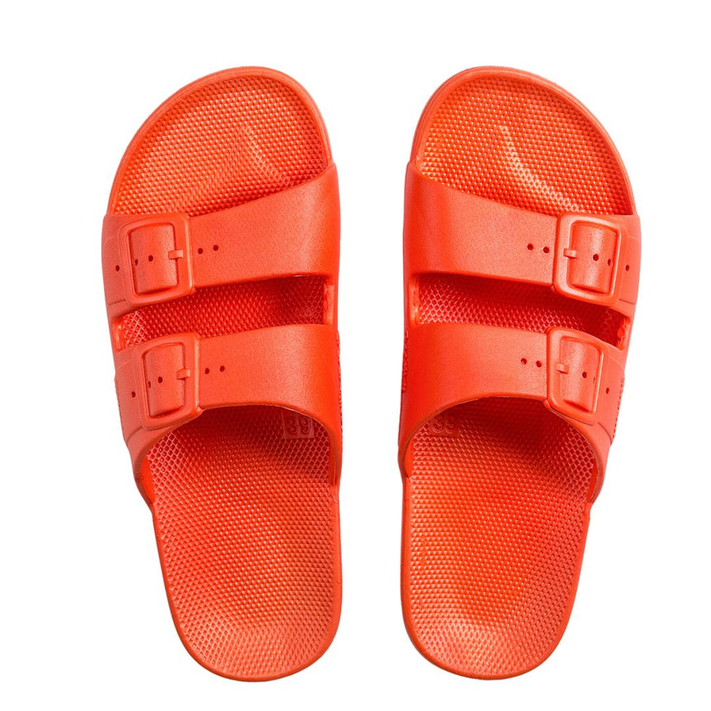 Freedom Moses Lucy Orange Neon Slides! Featuring a flexible PVC with great grip and anti-slip sole for maximum control, plus the ultimate footbed for unbeatable comfort and support.