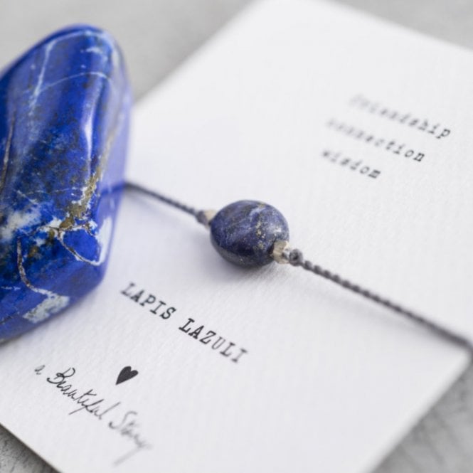 A Beautiful Story,  Gemstone Card Lapis Lazuli Silver Bracelet – a fashionable and meaningful gift! The cotton thread with a Lapis Lazuli gemstone stands for connection and truthfulness and is sure to strengthen any friendship. 