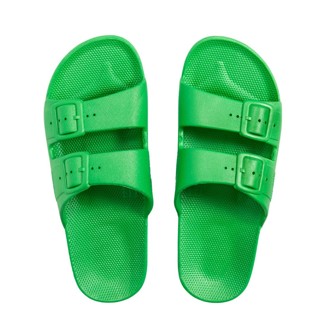Freedom Moses Marley Green Slides! Our cool sandals feature a flexible PVC and fixed buckles that provide a snug, secure fit with great grip. 